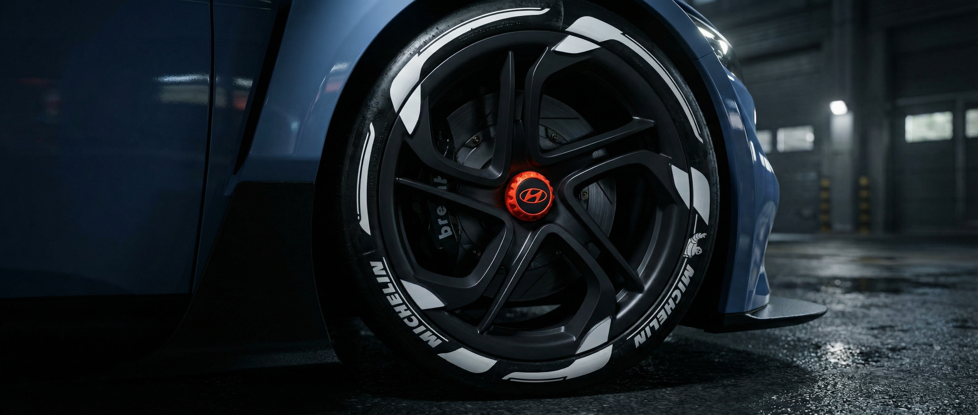 Close-up of a car wheel with a distinctive rim design in a garage setting Tire Stickers SA